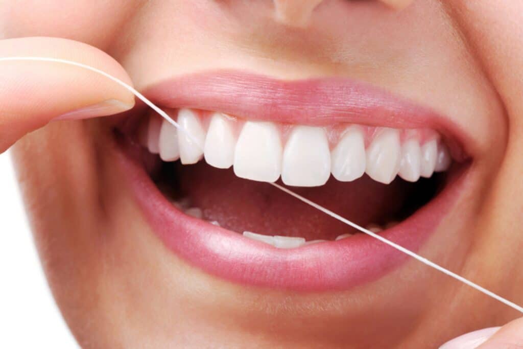 Should I Floss or Brush First? A Guide for Families in Ann Arbor, MI McNamara Orthodontics