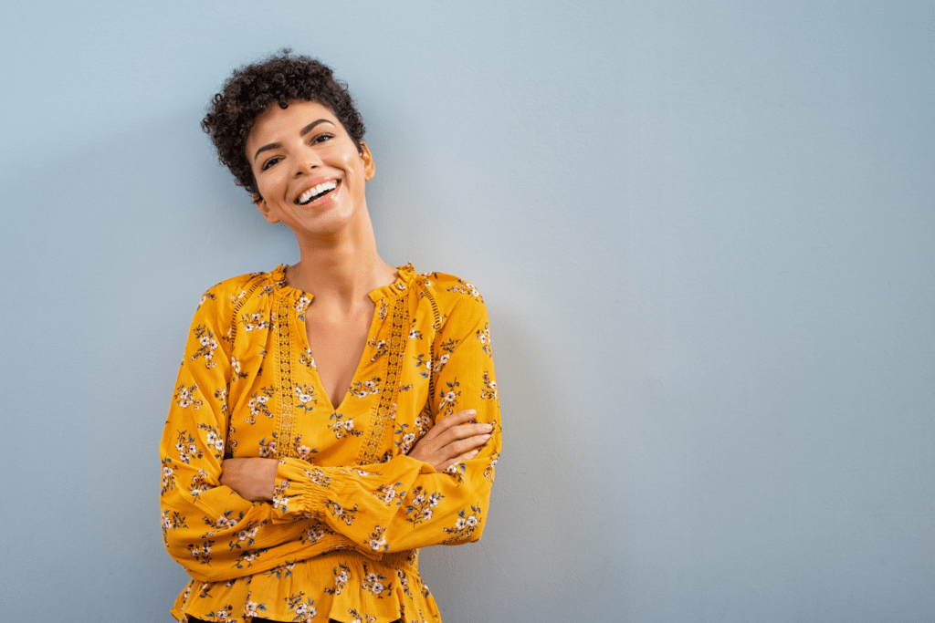 Smiling adult considering orthodontics to support gum health in Ann Arbor MI